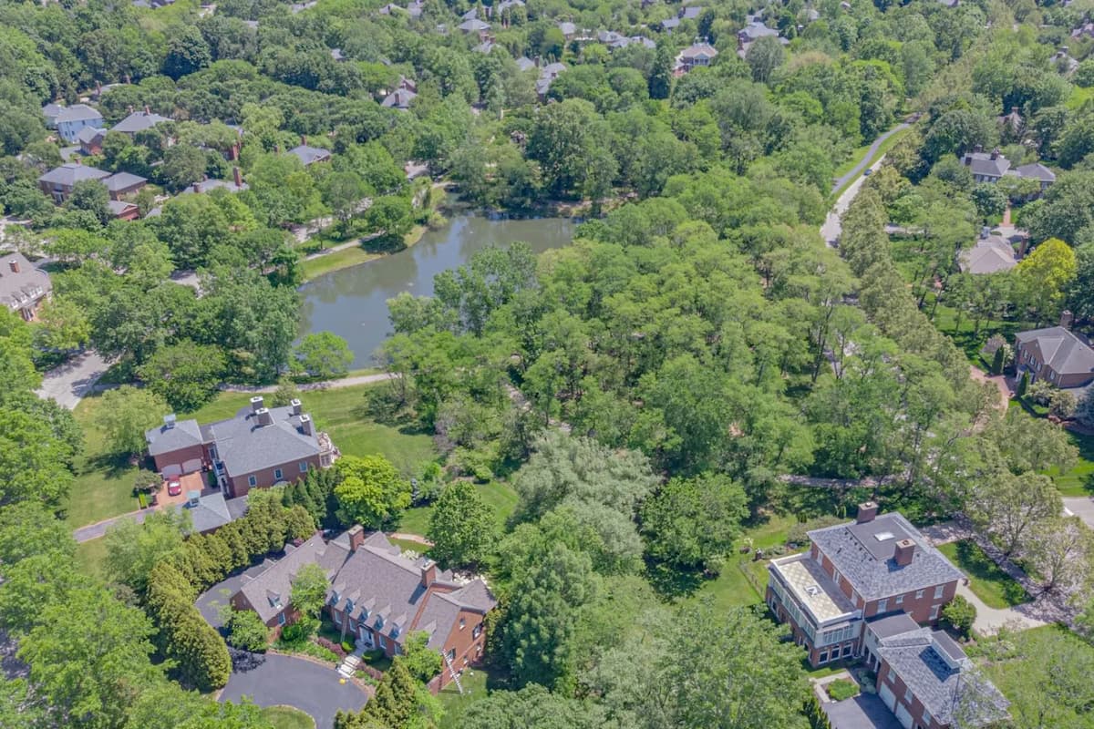 Aerial view of residential roof being measured for replacement estimate